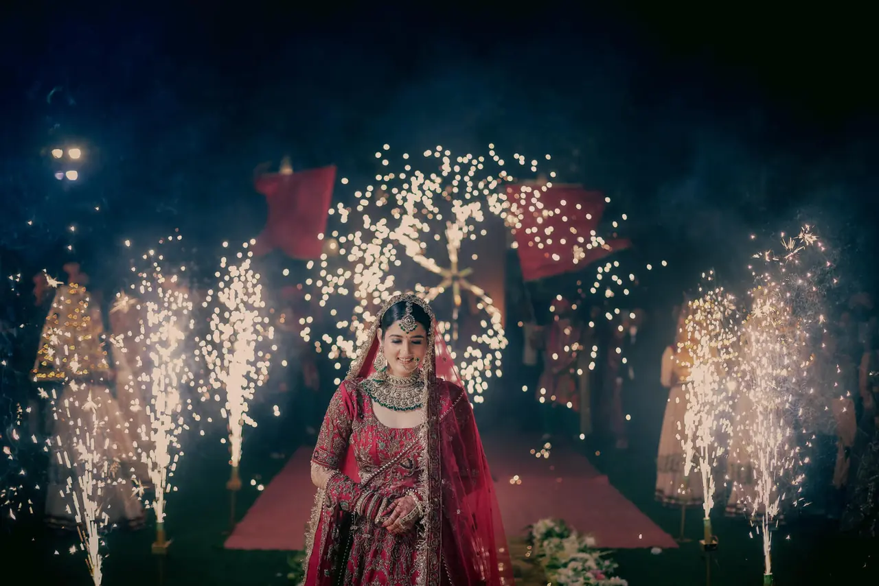 Bride under fireworks at the wedding